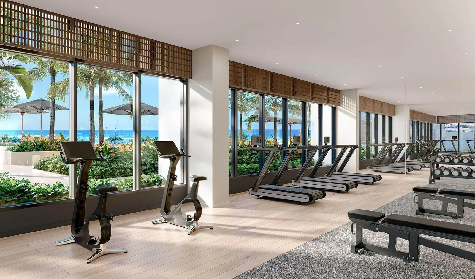 Clean oceanview fitness center with treadmills and bikes on Oahu